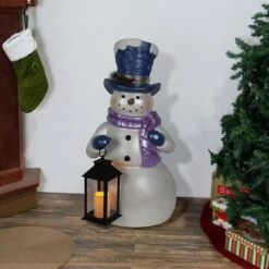 Lavender Winter Snowman Holding Lantern Statue W/Flash LED-LG Christmas Decor -The Home Depot Shop alpine corporation christmas yard decorations sky562l tm 31 1000