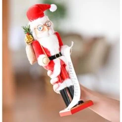 14 In. Wooden Christmas Santa Nutcracker Santa In Traditional Attire W/ A Bag Of Gifts On His Shoulder And List Of Names -The Home Depot Shop christmas figurines or 220 1f 1000