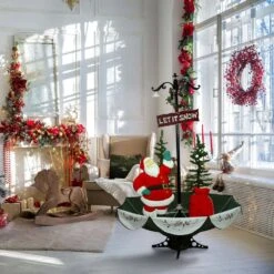 47 In. Christmas Red Santa With Green Umbrella Base And Music 22 47 In. Christmas Red Santa With Green Umbrella Base And Music -The Home Depot Shop fraser hill farm christmas figurines fsfsa066a red 4f 1000