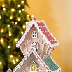 18.5 In. H Lighted Resin Christmas Gingerbread House Table Decor -The Home Depot Shop glitzhome christmas figurines 2040200013 4f 1000