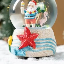 5.12 In. H Christmas Resin Musical Snowflakes Santa On Vacation Waterglobe -The Home Depot Shop glitzhome christmas figurines 2040300008 76 1000